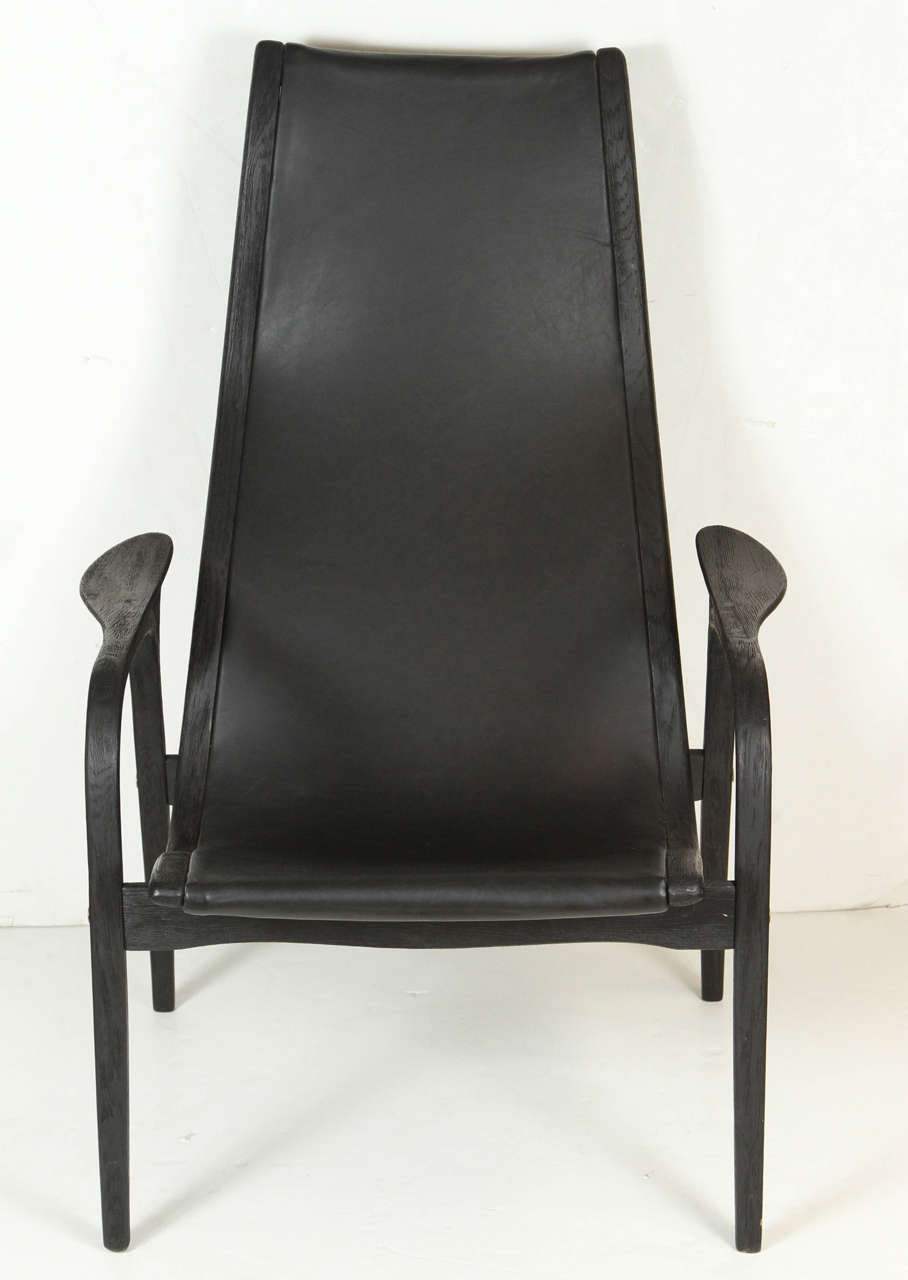 Mid-Century black leather Lamino chair, low slung with reclined back. Designed Yngve Ekstrom in the 1950s, manufactured in the 1980s.