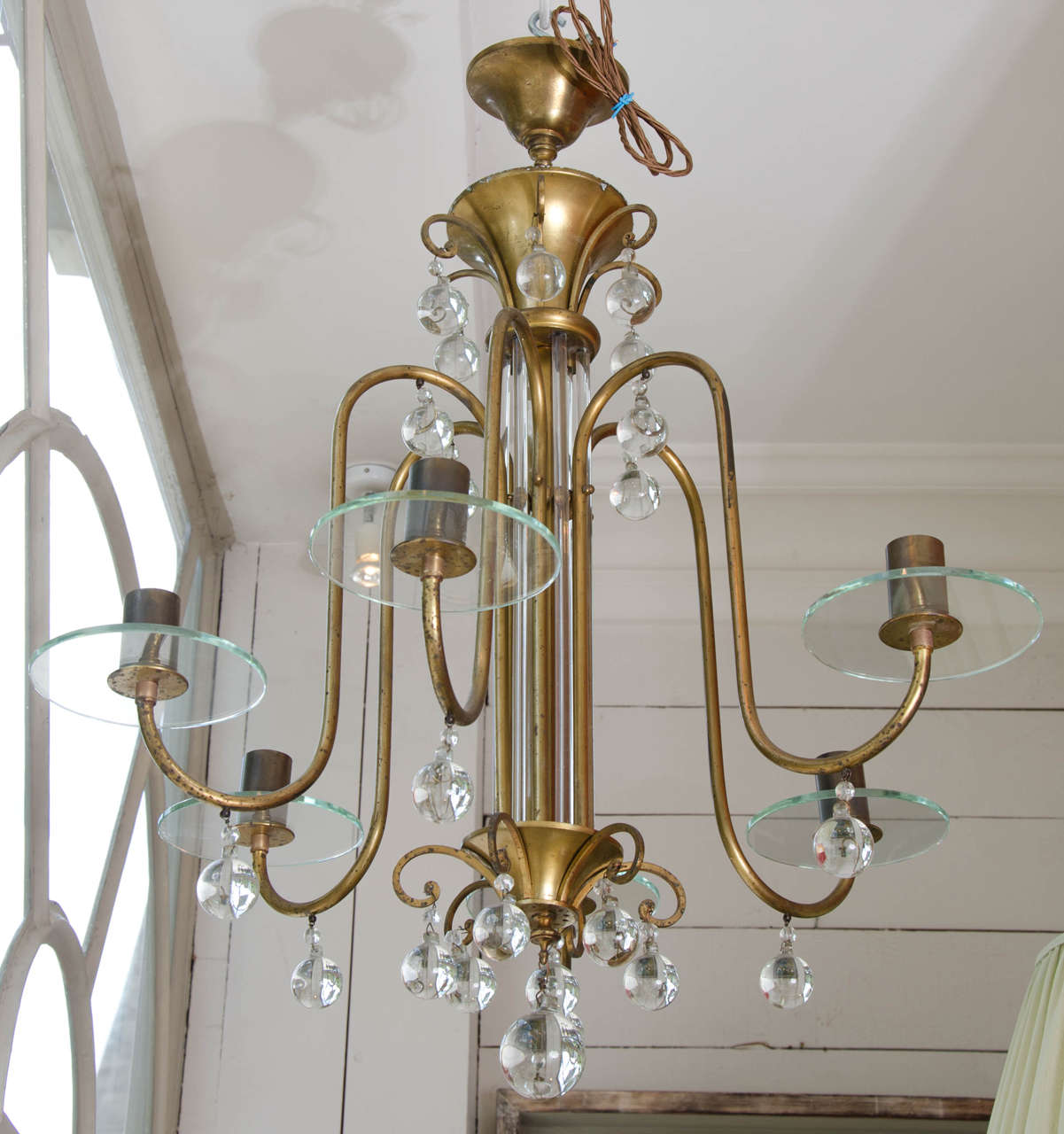 A mid 20th century six light French ormolu and glass balled chandelier.