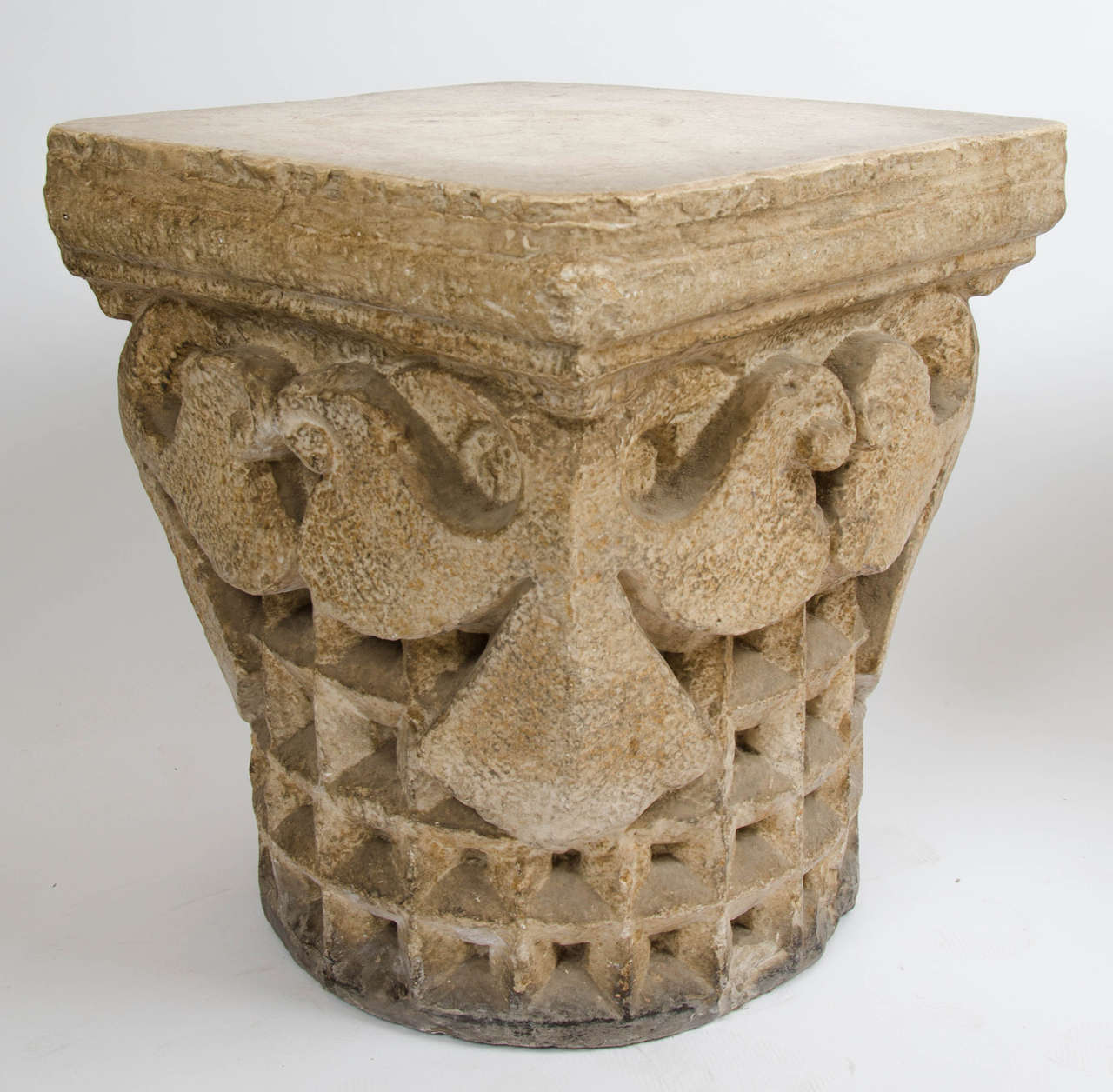 A pair of mid 20th century plaster carved capitals in the Syrian taste.