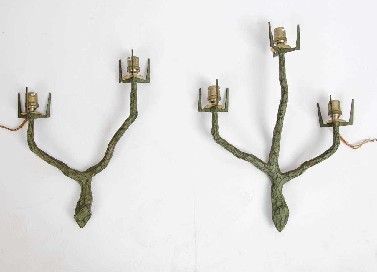 A rare pair of bronze two and three light wall lights by Maison Arlus in the manner of Felix Agostini.