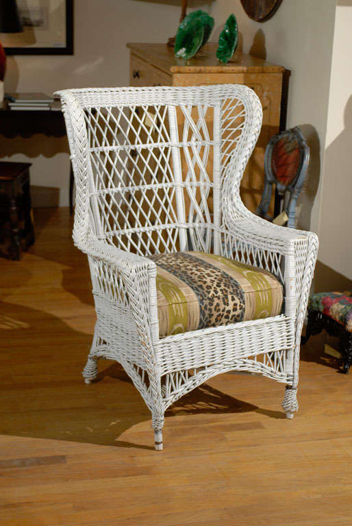 This is a handsome winged chair.  The Bar Harbor wicker chair has a braid that starts at one foot and leads up around the back and down to the opposite foot.  The chair is strong and sturdy and sits well.  It is a beautiful piece of Americana.<br