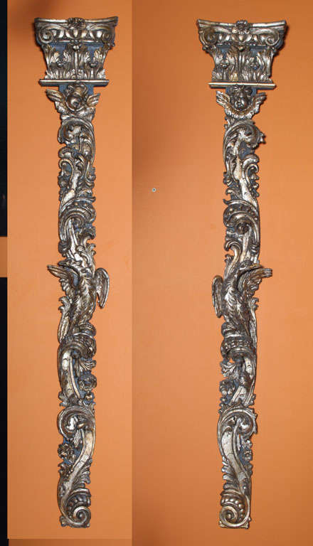 The carved capitol above a flat column carved overall with birds, foliate, rocaille and swags.