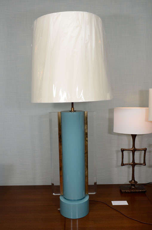 Turquoise lacquered wood form with beautiful Lucite fins and brass mounts. Edith Norton, based in LA, worked during the post-war period and created some very unusual lighting using lacquered wood, metals and Lucite. This lamp is a great example of