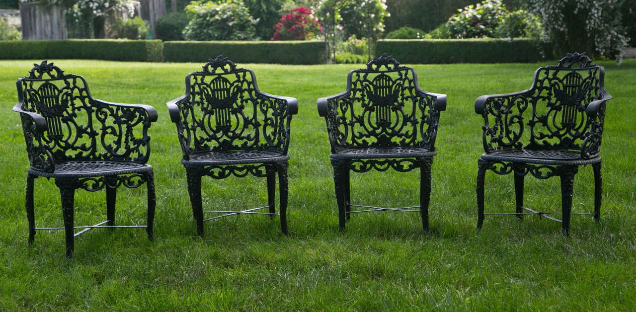 A group of four cast-iron armchairs, with lyre backs and floral motif, attributed to Wood & Perot.

Though the maker’s mark on these chairs is almost completely obscured, it is likely that they were produced by Wood & Perot (1858-1866), or its