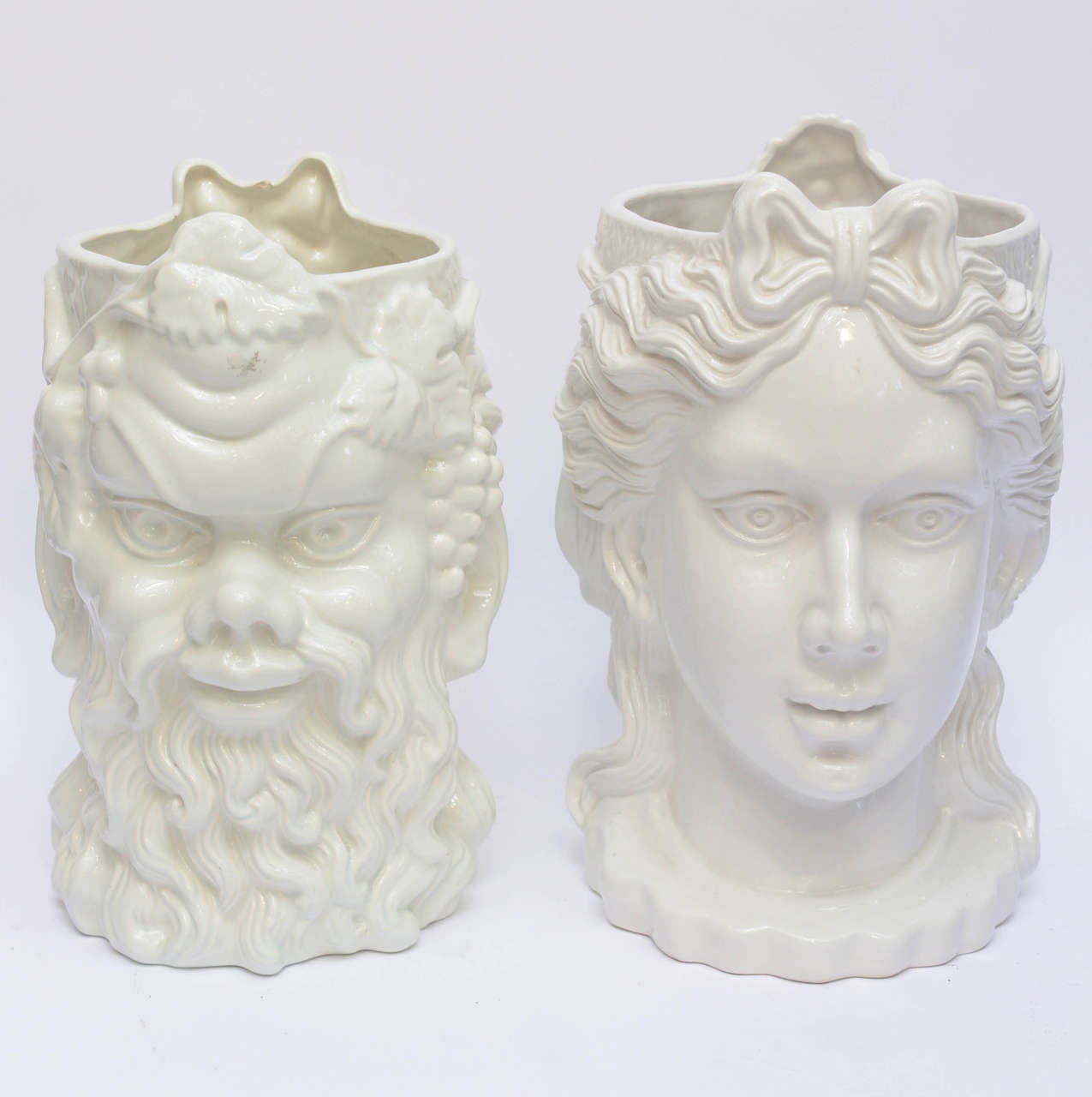 Rare Pair of Italian White Ceramic Planters . These are Double faced, a Grecian Noblewoman and a Satyr.
One Planter is slightly smaller. Large one is 15 Inches tall the other 14 Inches tall.