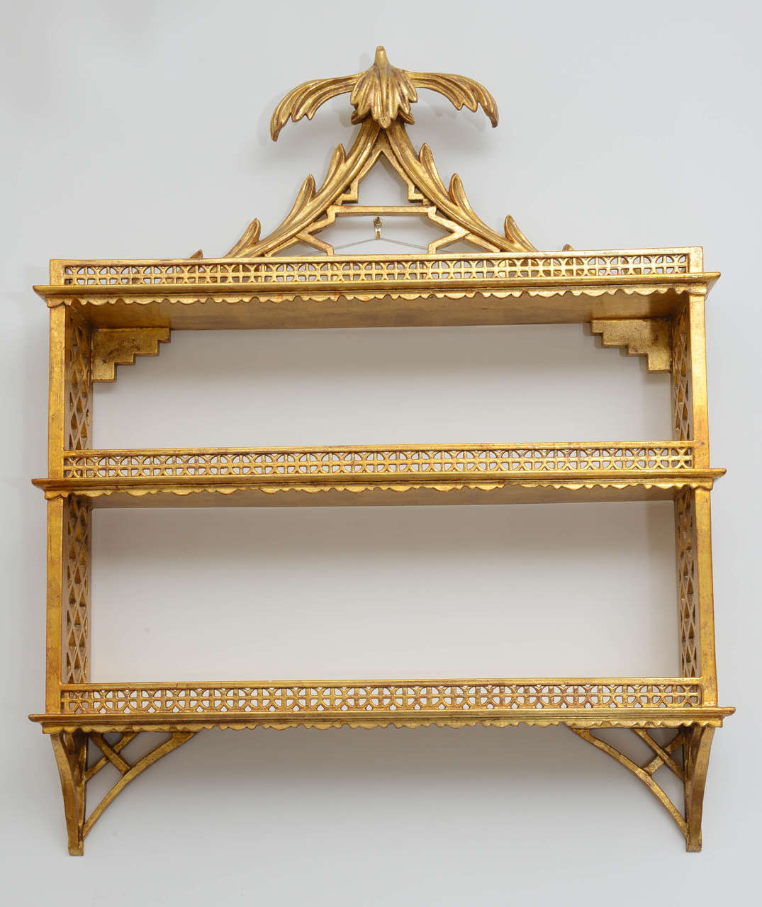 Hollywood Regency Style carved and gilded wood pagoda wall shelf.  Beautifully detailed with fretwork and fronds.