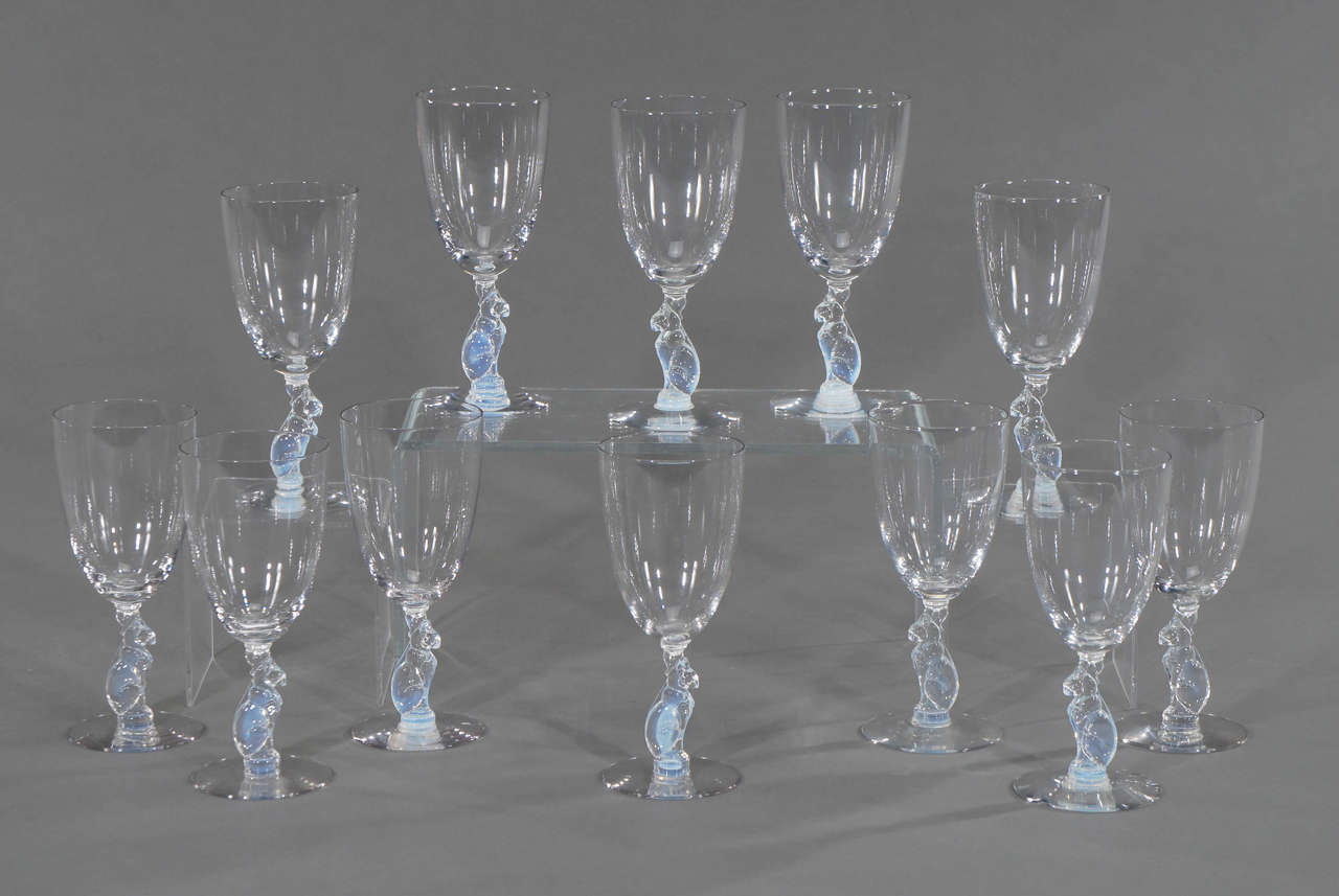 Usually found a single examples by avid collectors, this is a fabulous set of 12 matched, large water or wine goblets. Designed by A. Douglas Nash, former designer and manager for L.C. Tiffany, he later worked at Libbey Glass and created this series