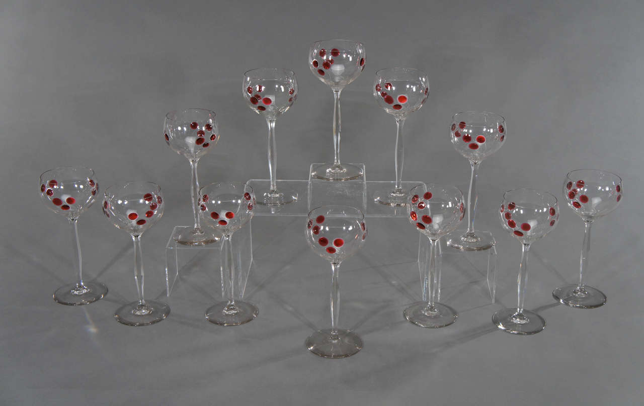 A dramatic and rare set of 12 hand blown TALL crystal goblets with red marquetry 