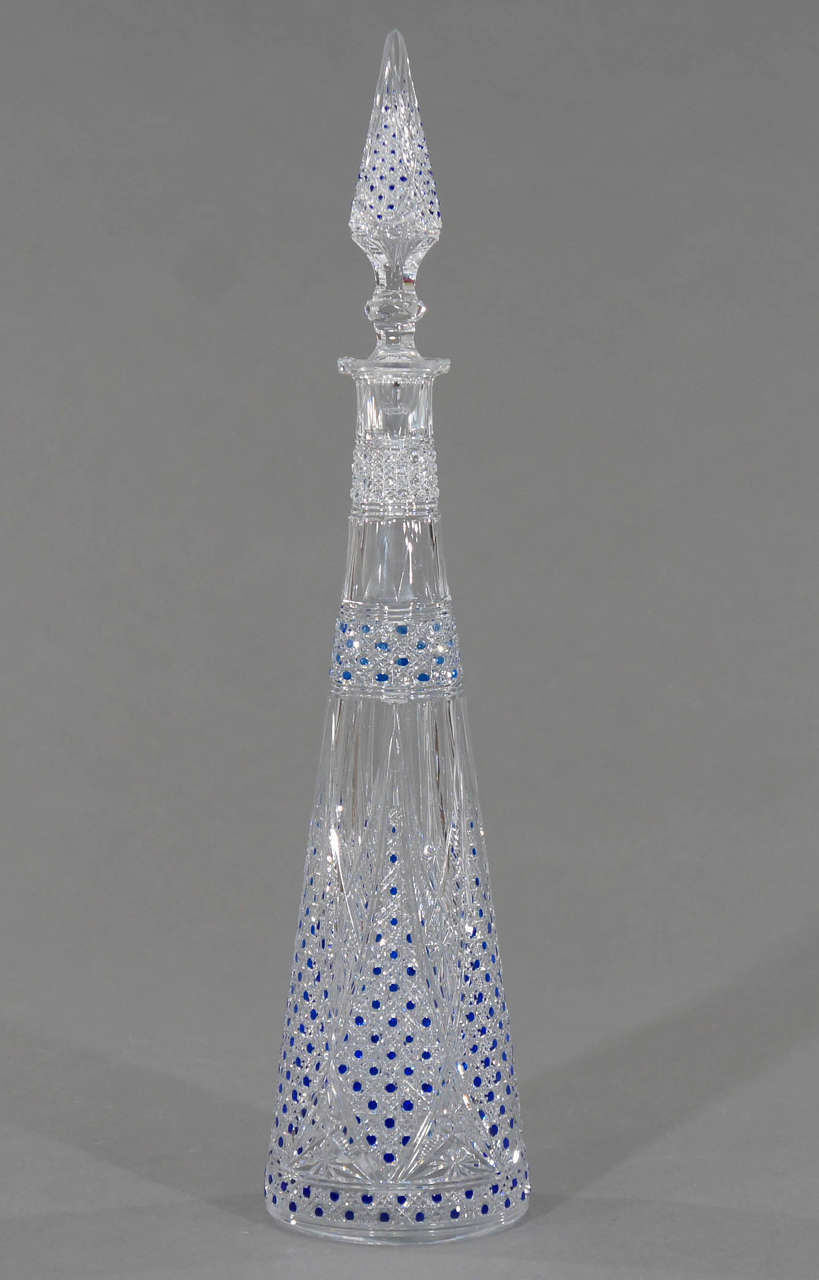 This rare decanter is 19th c. Baccarat at it's finest. The body is clear crystal and overlaid in cobalt crystal and then masterfully cut back to cobalt  in the most minute, detailed, masterful cutting possible. Each drop of blue is like a jewel