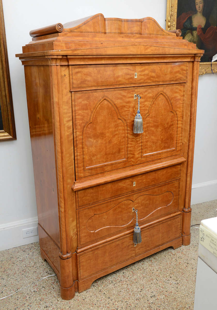 A rare find & museum quality in this very unique antique.  A single, full width drawer over the drop front portion & two full width drawers below.  The interior of the drop front hold many drawers & doors for storage.  It also has two very secret