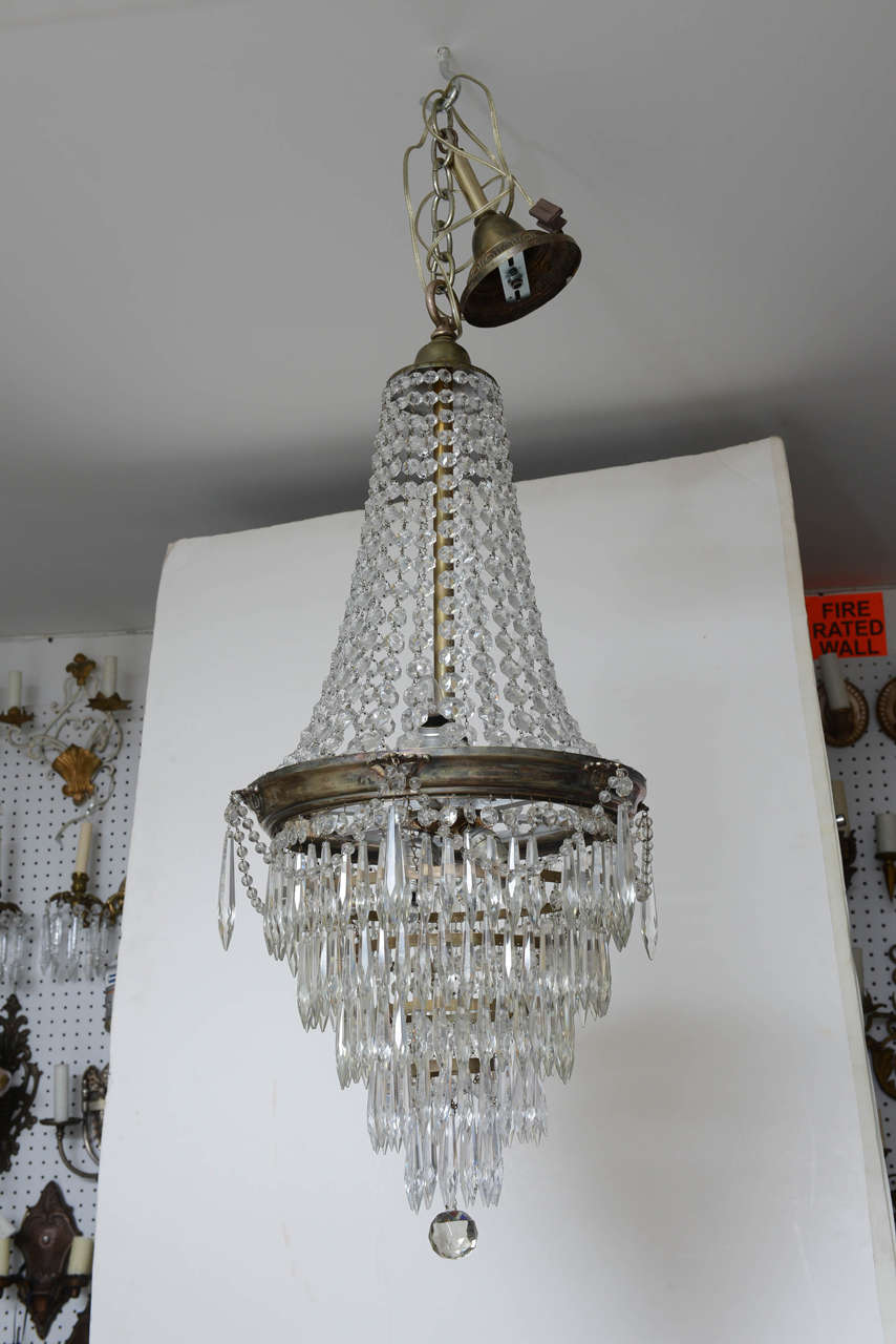 Dressed with Icicle prisms, this is a chandelier that could work in many locations because of size.  Crystal prisms are accented by silver.  Newly wired.

Originally $ 2,400.00

CHECK OUT OUR WED SITE FOR ADDITIONAL SPECIALS