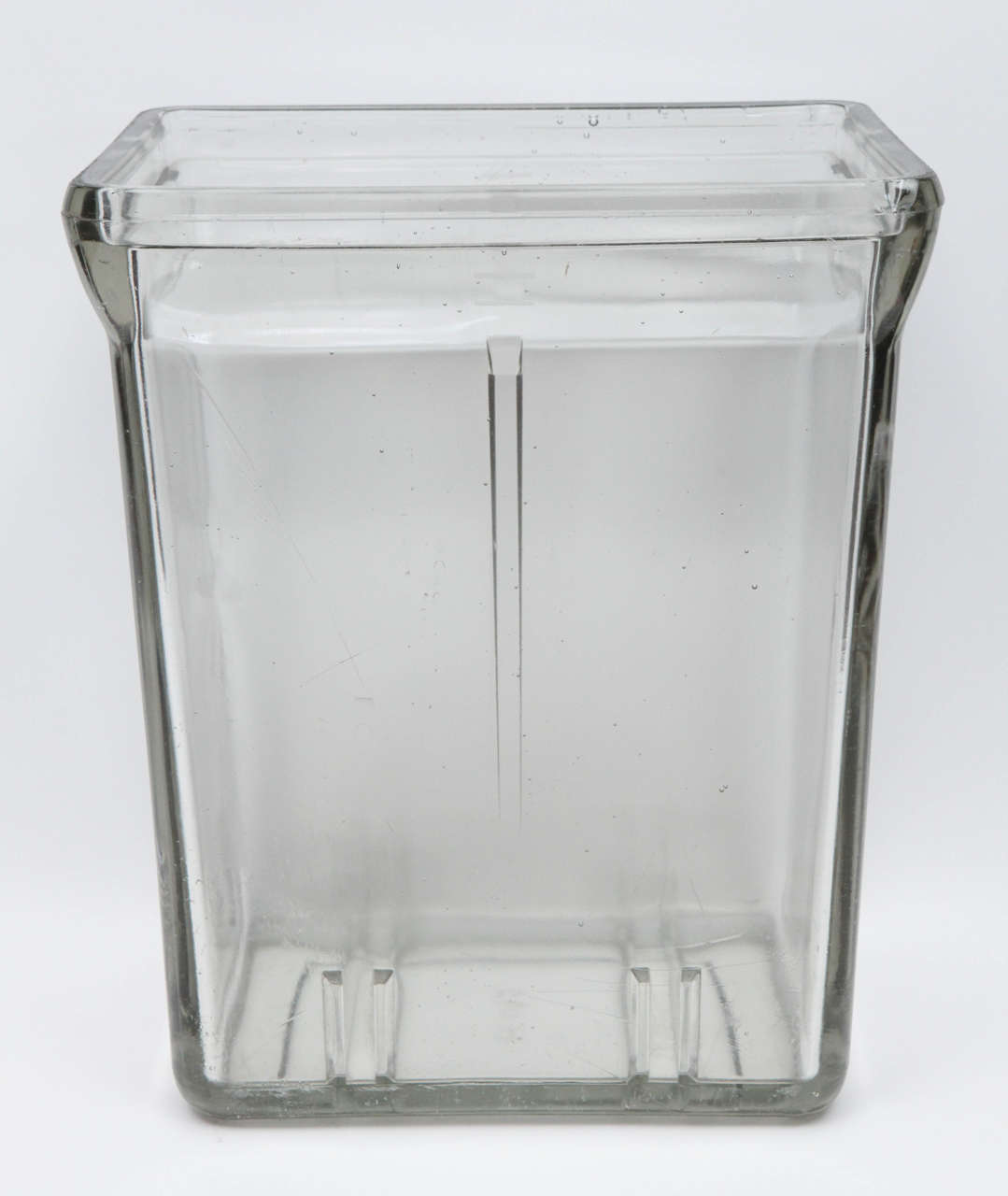 We were thrilled to find this rare large Industrial glass battery case that we assume comes from a larger vehicle like a truck or tractor. We have seen battery jars from this same era but have never seen one this large before. It has a wonderful