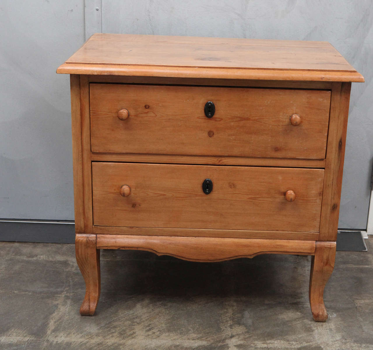 This is a excellent example of great craftsmanship with beautifully turned wooden knobs, beveled and shaped apron at the bottom and nicely shaped sturdy legs. The solid dovetail joints on this handsome little piece is more evidence of its quality