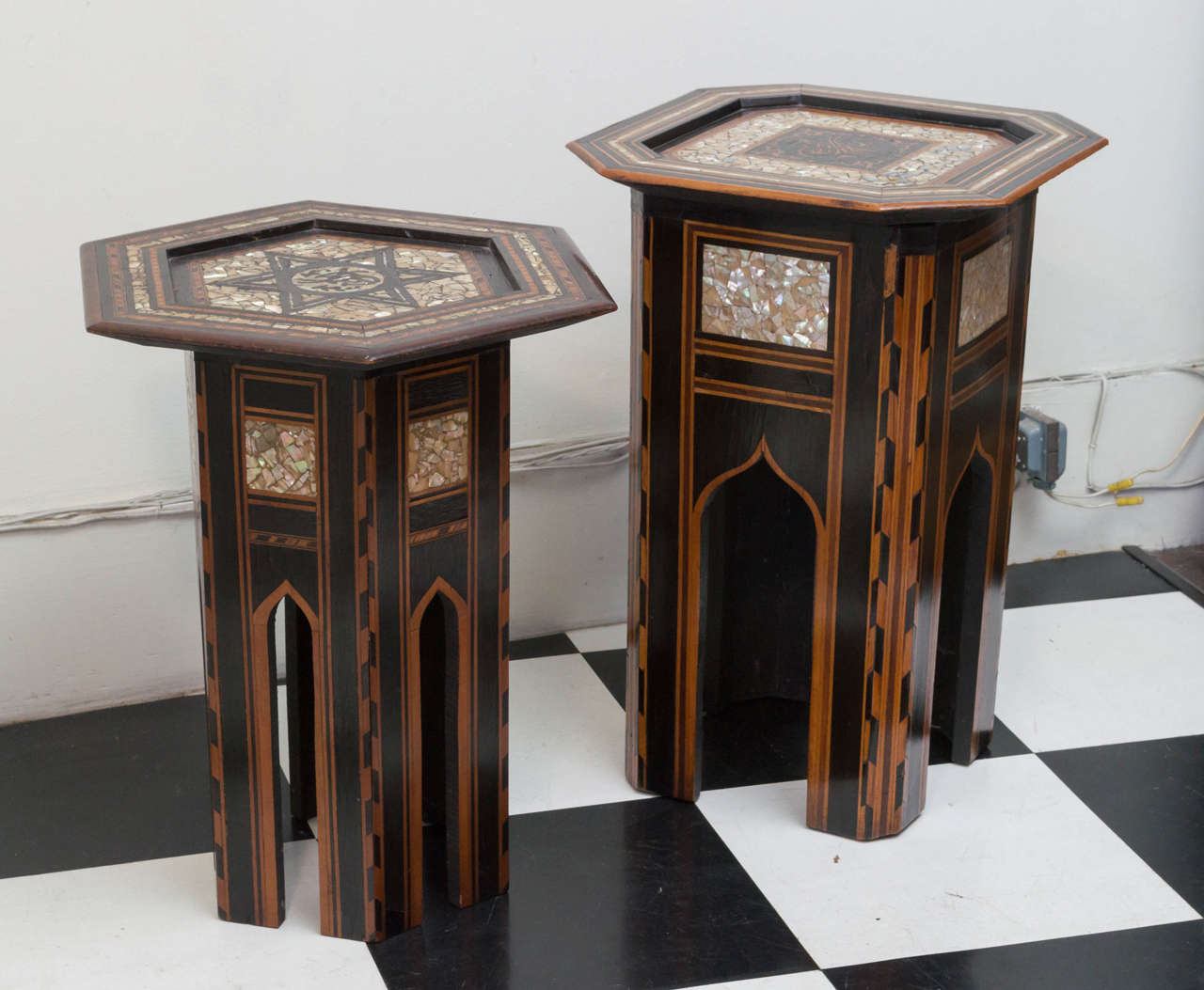 Pair of late 19th c. very fine inlaid Syrian taborets. Octagonal tops with fine inlay of woods and mother of pearl. Arched shaped side panels. Very closely detailed contrasting inlaid materials are visual and textural.