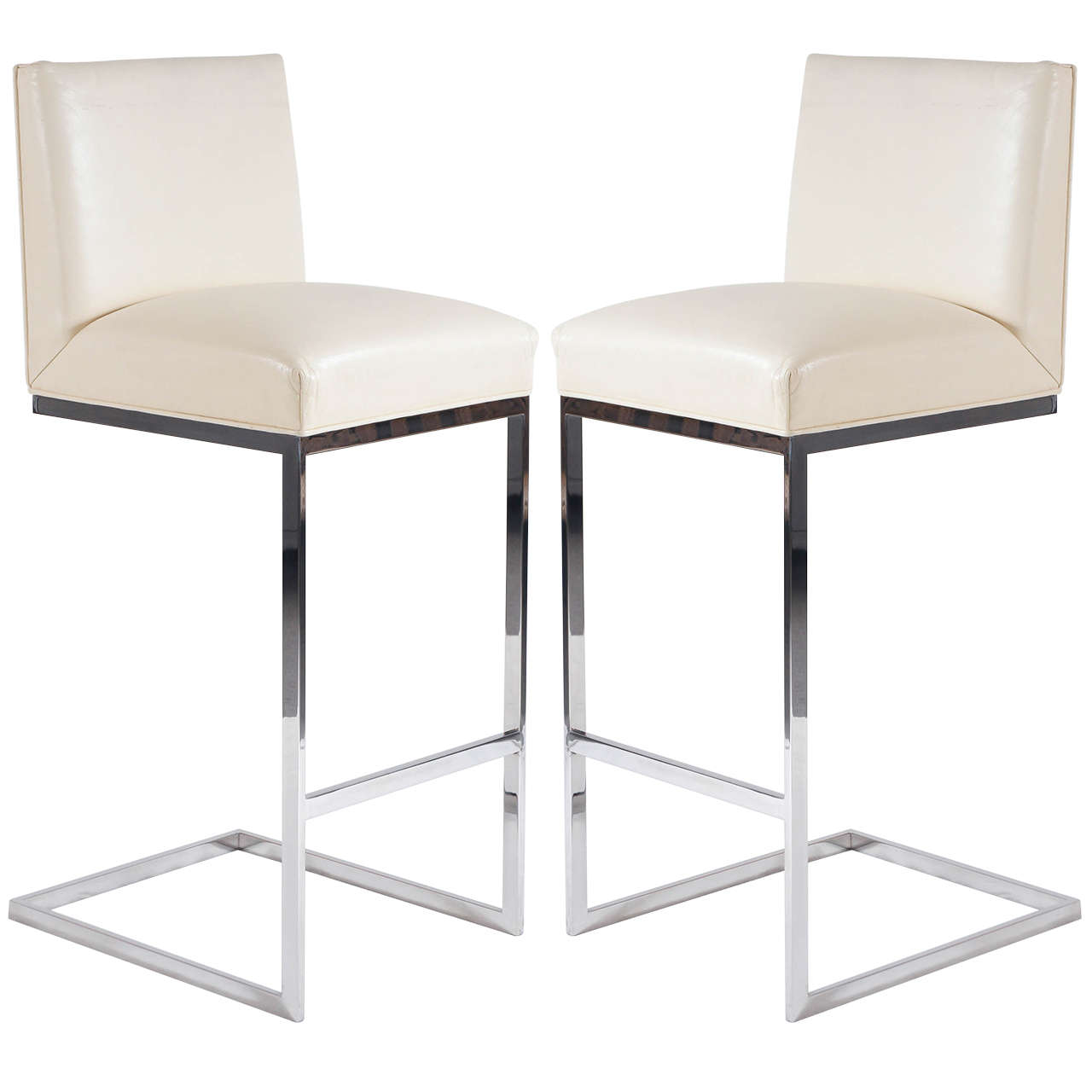 pair of bar stools in leather polished stainless steel by Brueton For Sale