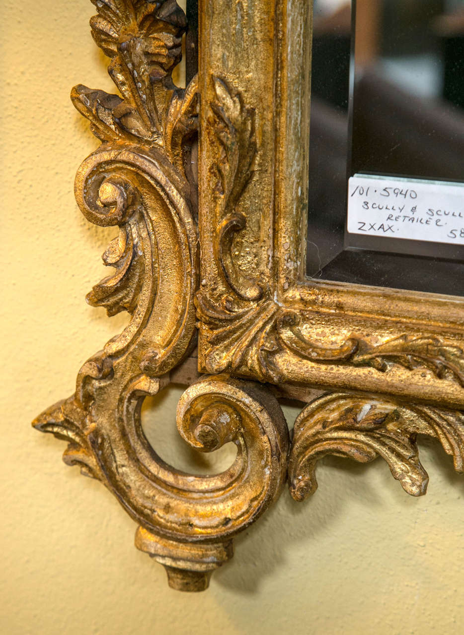 North American Pair of Rococo Carved and Giltwood Mirrors