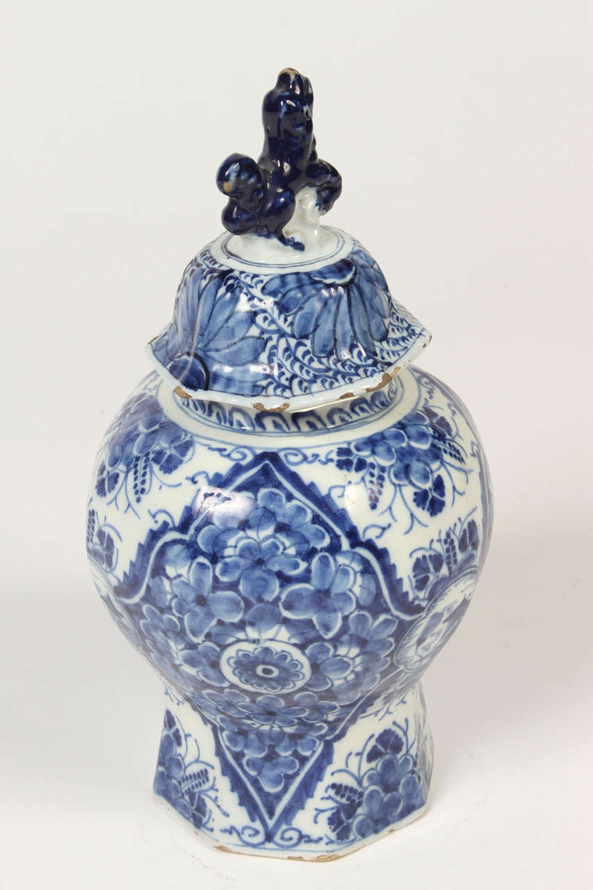 18th century Delft faience, covered vase. The classic baluster form is topped with a chimera figurehead. This would be a wonderful addition to a Delft pottery collection.