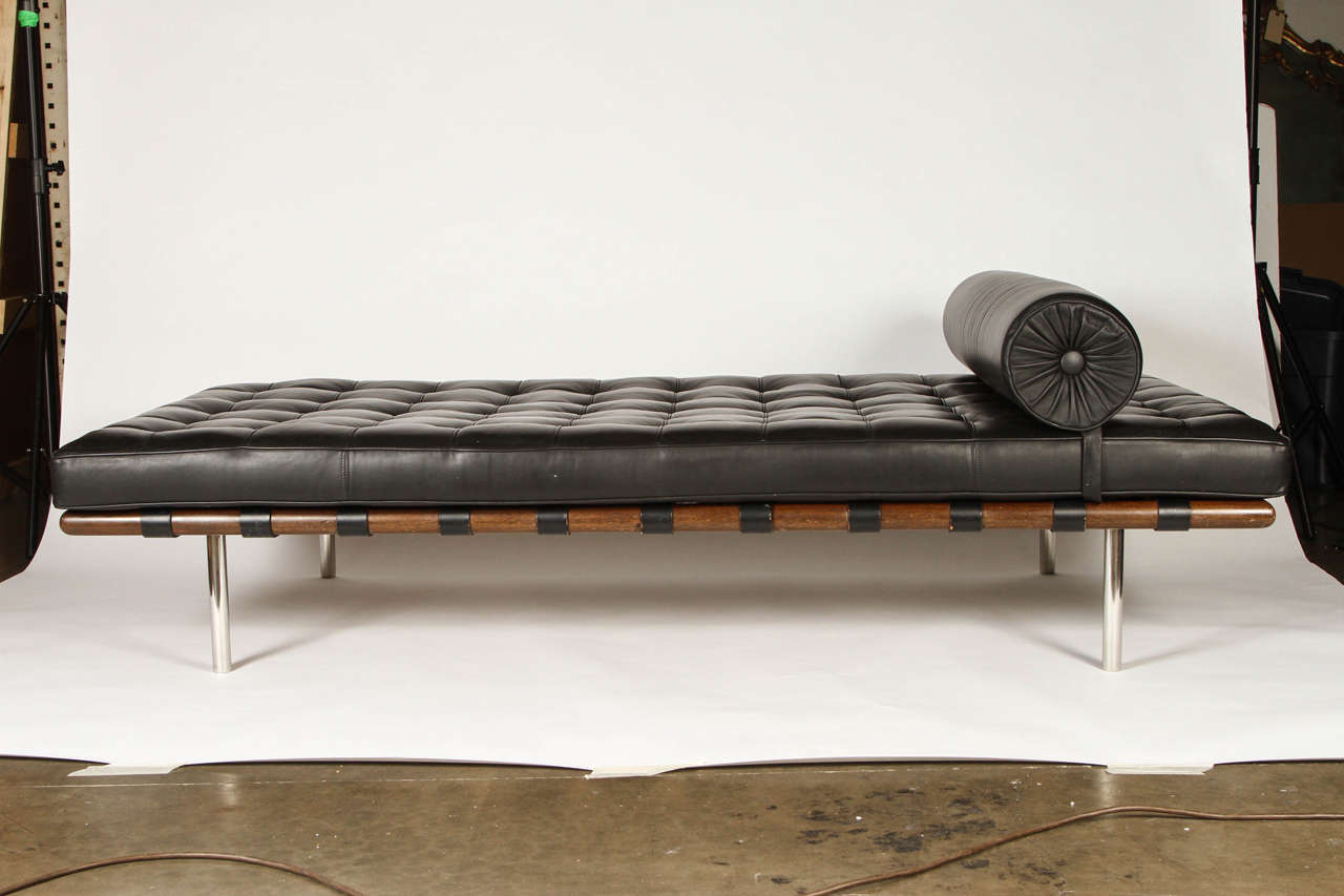 The Barcelona daybed was designed in 1930 by Ludwig Mies van der Rohe and gained a widespread popularity in the 1950s persisting until today. This version in black, the frame is made of walnut, the feet are made of stainless steel. Perfect