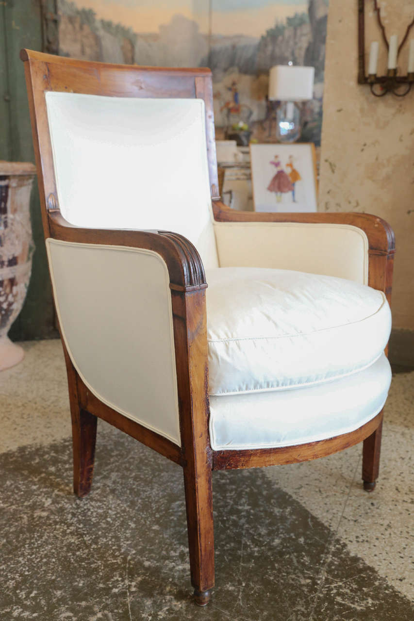 Directoire style armchair in fruitwood. Reupholstered in ticking with down cushion. 26.5