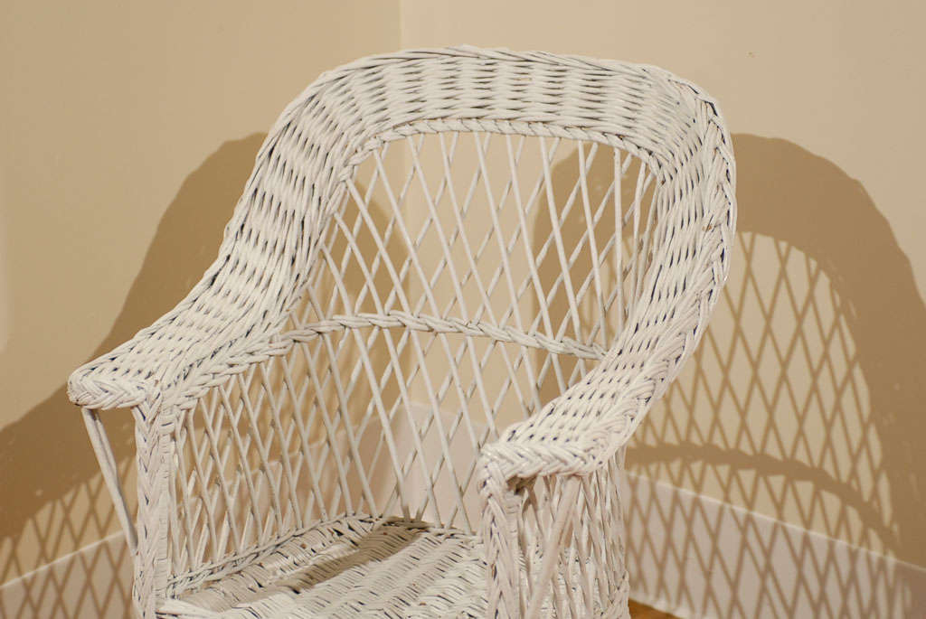 This is a wonderful American wicker rocker in the Bar Harbor style.  Children love a chair or rocker that fits them and this is a perfect rocker.  The style is clean lined and very handsome.  This is a beautiful example of Americana.<br />
<br