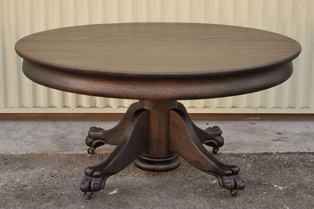 THIS FANTASTIC FORM CARVED OAK AND PAINTED A LIGHT BLACK PAINT COFFEE TABLE IS IN GREAT CONDITION.THE SIMPLE DETAILS OR LINES MAKE IT GREAT FOR ANY DECOR.THIS TABLE HAS CARVED FEET AND IS ON FOUR CASTERS THAT MAKE IT EASY FOR MOVING ON OR OFF