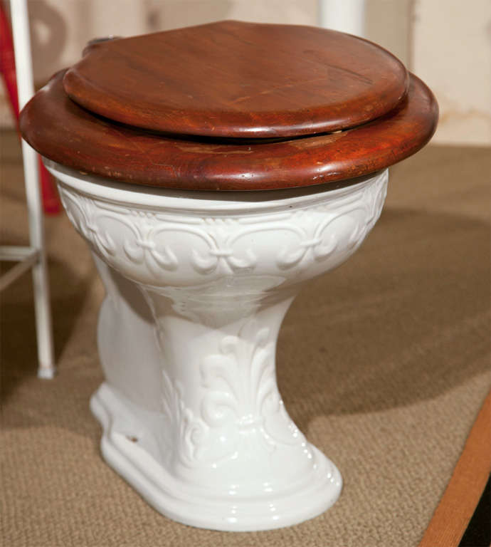 Embossed Toilet with Wooden Seat by Wolff Company, Chicago.