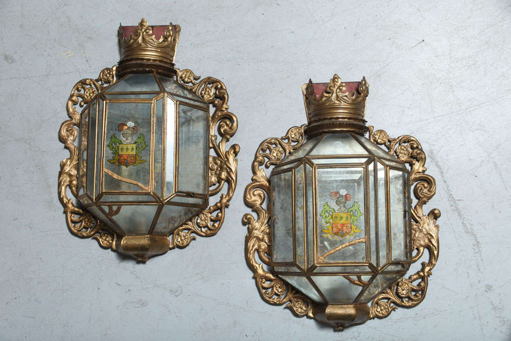 Fabulous pair of candle sconces with Armorial painted design from Palm Beach Estate.