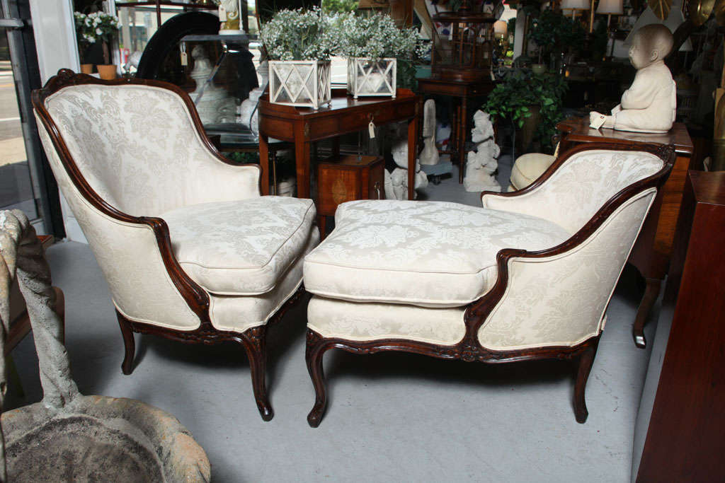 Two part arm chair and ottoman, also referred to as a French daybed known as the Broken Duchess.
