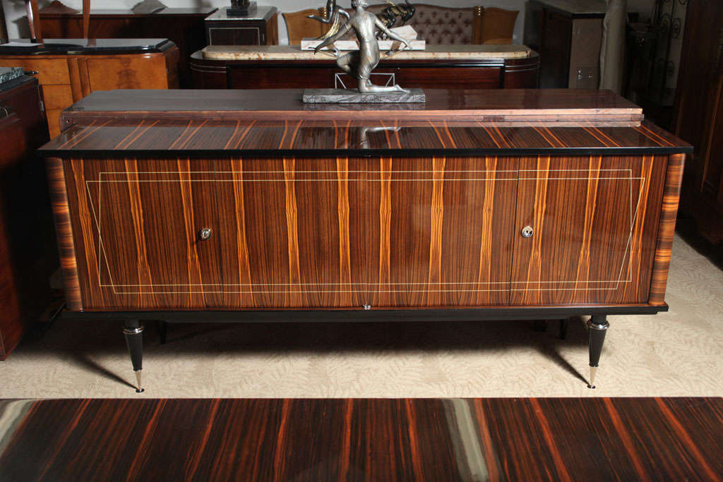 French Art Deco exotic Macassar ebony buffet, high polish nickel-plated accents and hardware, toupie feet, interior finished in lemonwood.