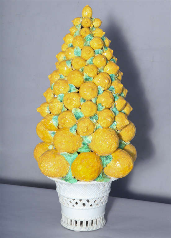 Pierced basket of lemons, of handpainted ceramic pottery, very large scale piece with layers of stacked lemons.