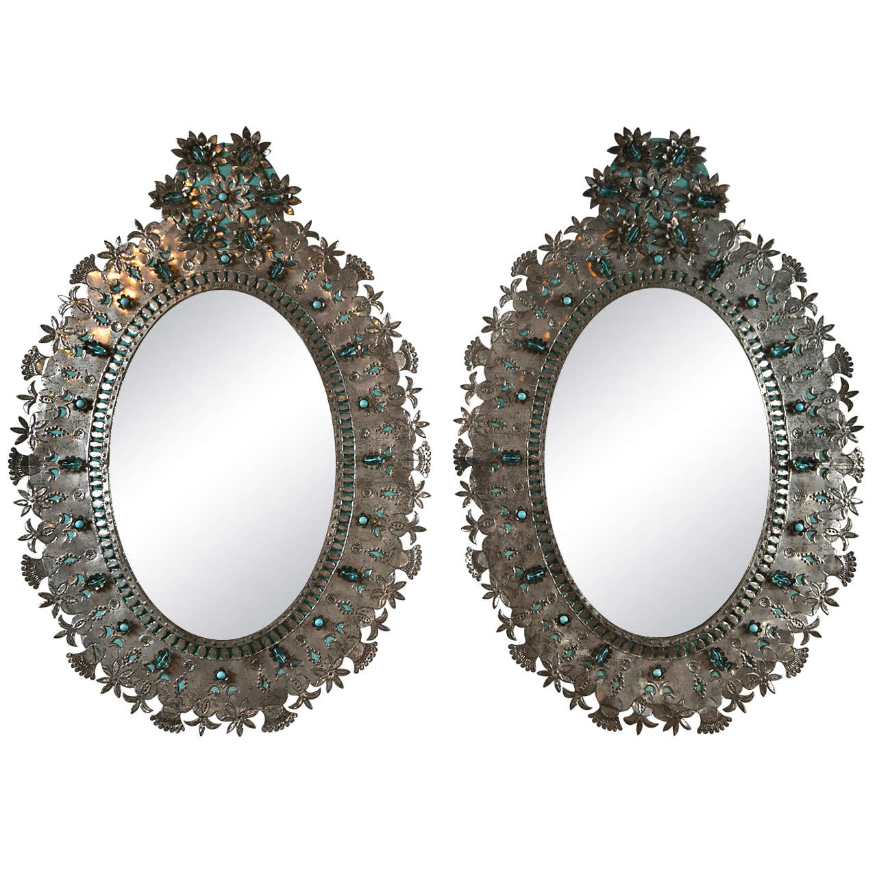 Pair of Mexican tin oval mirrors, c.1950s.