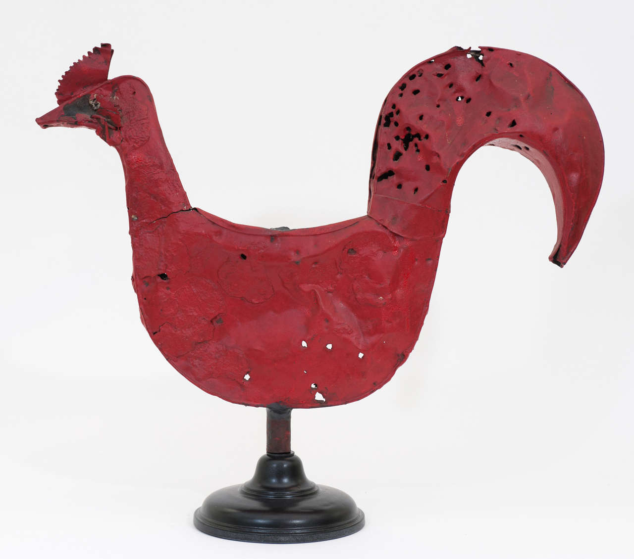 An authentic Quebec  rooster weathervane in original red paint from
the the Brome Lake region of the Eastern Townships. This rare
folk art weather vane has been in the same household for over 50 years. It is mounted on a stand but it can be easily
