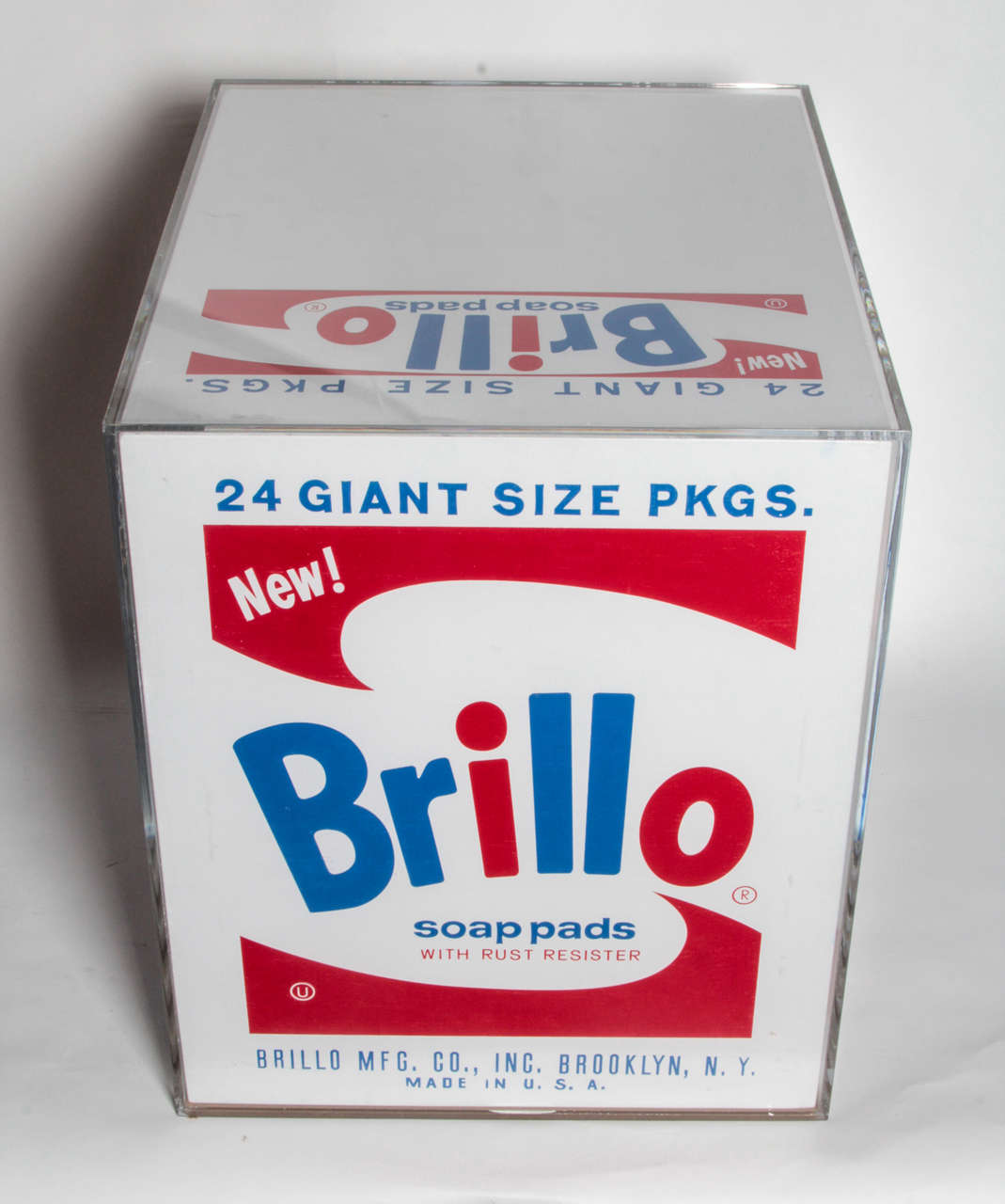 This wonderfully replicated Andy Warhol Brillo Box has been encased in a custom fabricated lucite box. Hewing to the original details of the Warhol Brillo Box, the artist recreated this iconic Pop Art work.