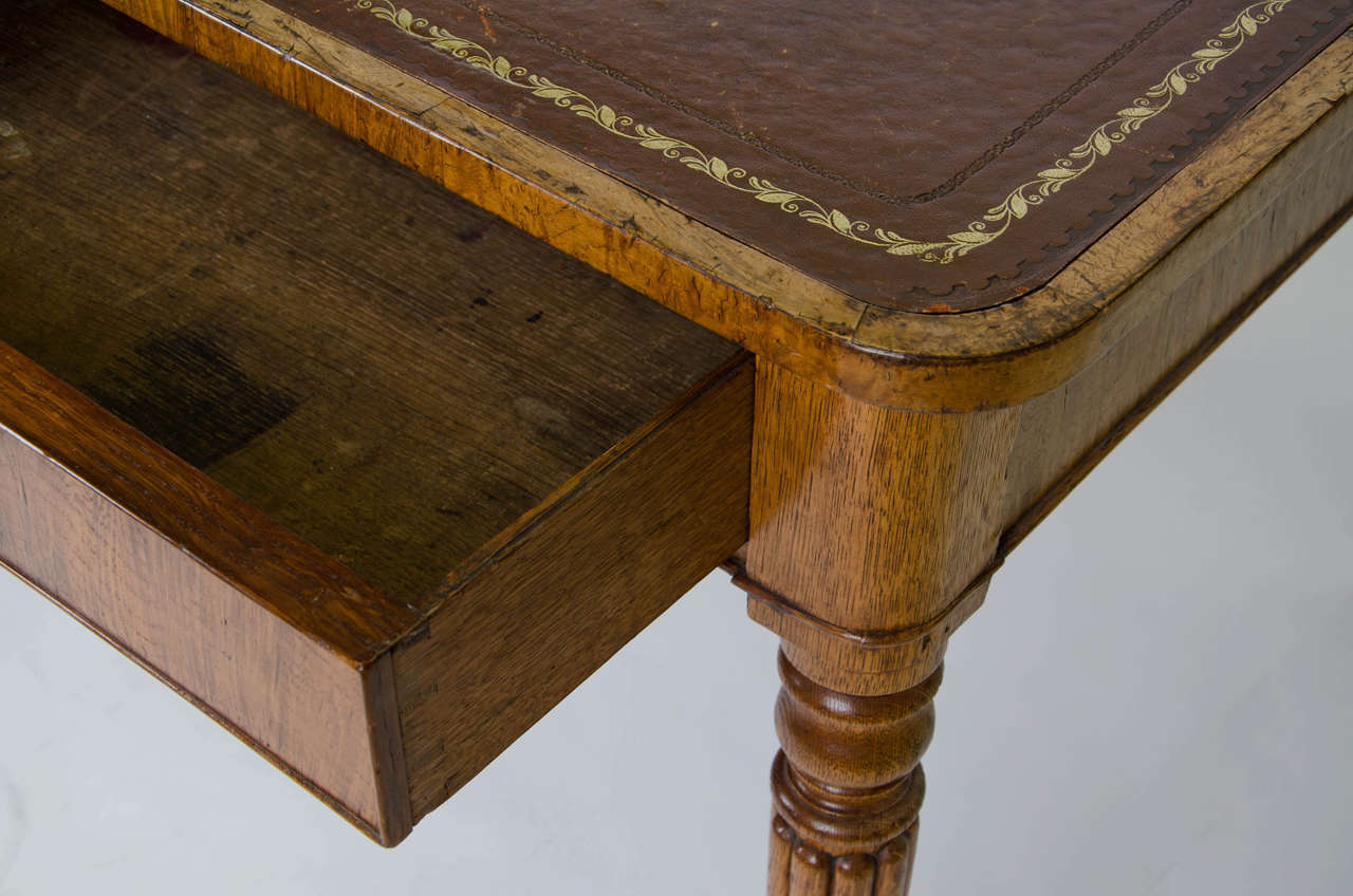 George IV figured oak Partners Writing Table having two drawers that operate from both sides.