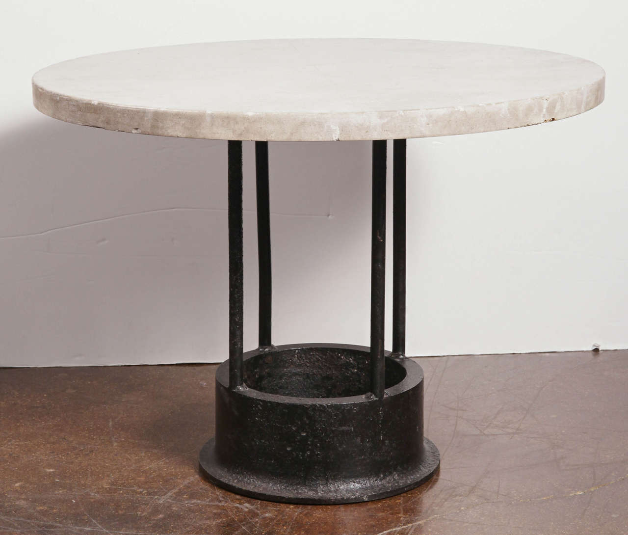 Vintage cast iron tool mount with limestone top as dining table, two available.