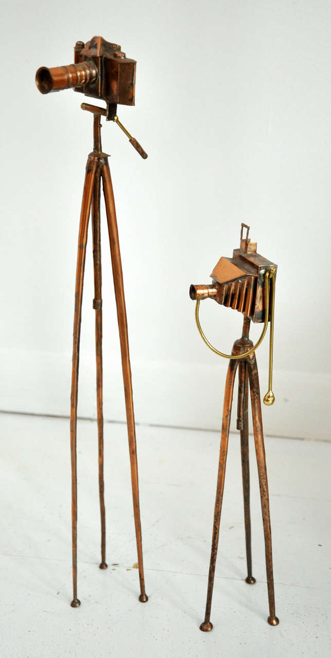 Antique artisan metal cameras on stands. Tall camera stands at 17". Short camera stands at 12".