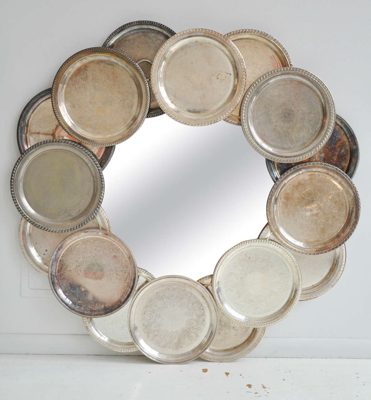 A unique statement piece! Mirror designed from a collection of antique silver plates.