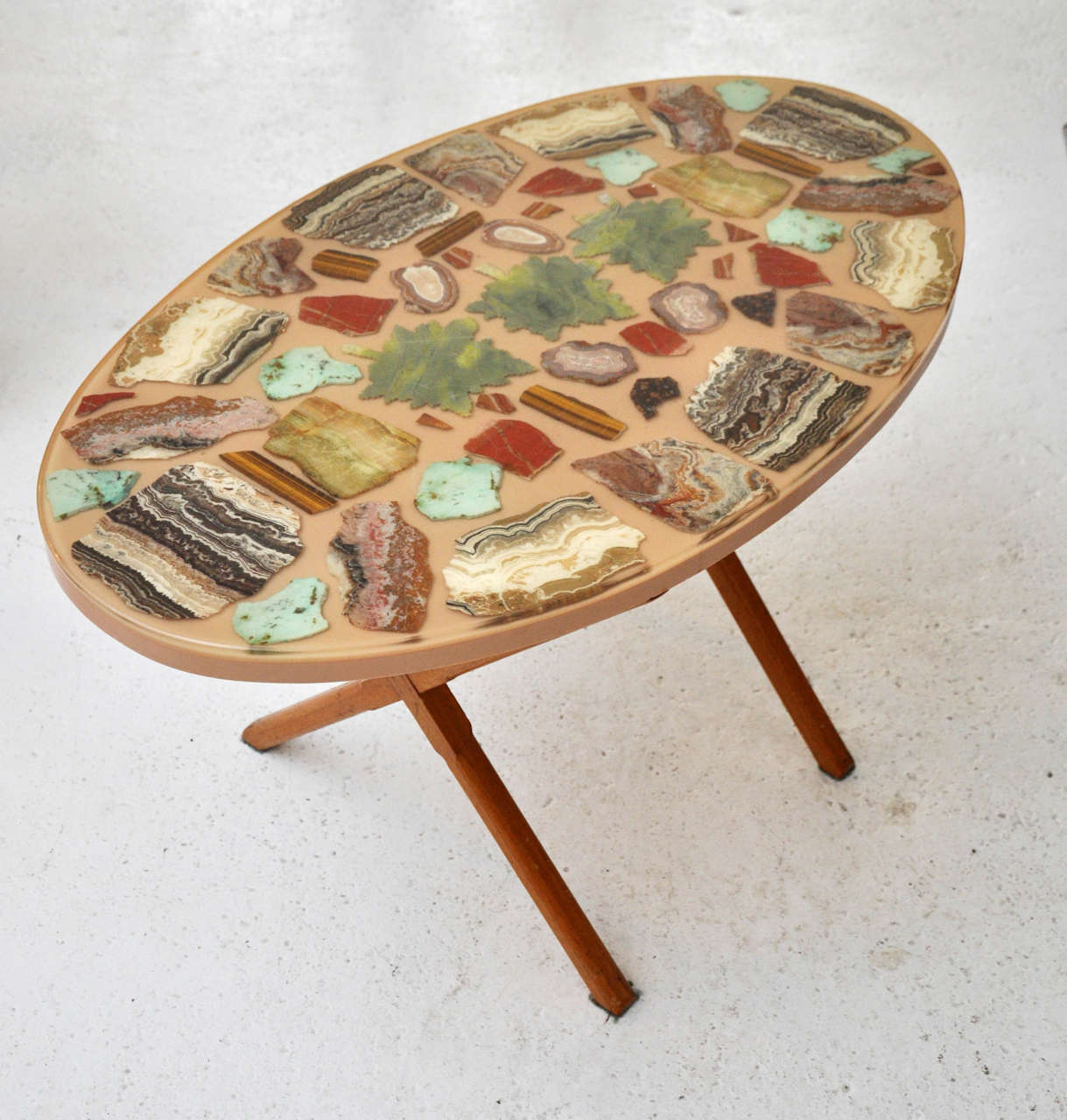 Antique oval table with varying agate slice inlays.