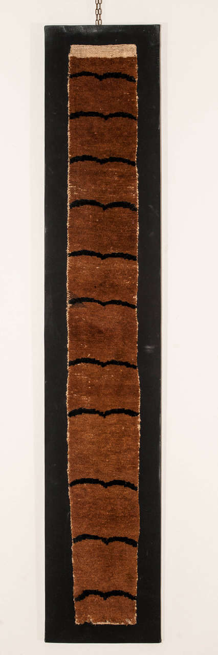 A rare Tibetan rug decorated by a stylized tiger pelt pattern. The tiger pelt was a symbol of high rank in Tibet, employed almost exclusively on weavings which belonged to the religious as well as secular upper class. Following a series of important