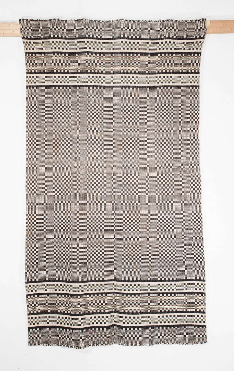 A very chic flat-weave woven in a technique that is completely different from what we are accustomed seeing in Berber textile art. I purchased it a few years ago from a Moroccan picker who sourced it near the border between Algeria and Morocco,