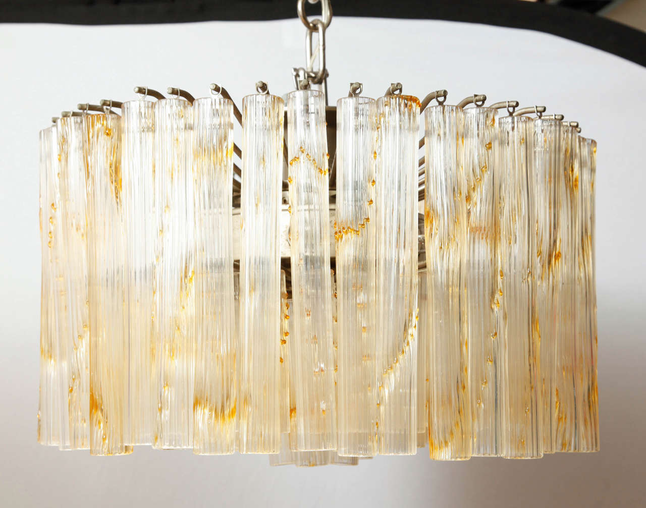 'Fiorito' glass chandelier and/or ceiling light executed Venini, glassworks in Murano, Italy made of clear ribbed glass tubes with yellow amber 'drops.
Impressed marks on the fixing (see last image).