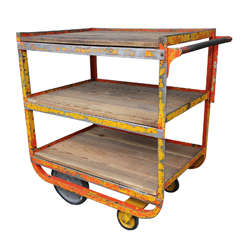 orange and yellow rolling industrial cart