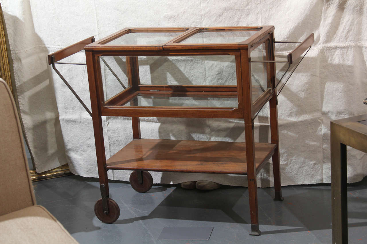very nice rolling cart with locking drop down sides.  beautiful for bar or tea cart 
great as vitrine to showcase special items