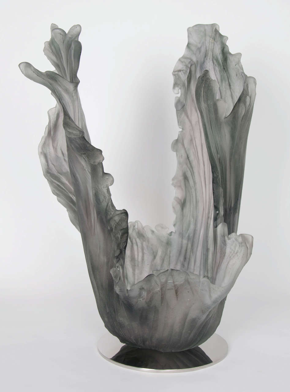 Brisbane is the UK’s foremost sandcasted glass artist.  She exploits this spontaneous and organic technique by using sand as a manipulable mould to make detailed, delicate glass forms with texture. Inspired by water and the natural world, each piece