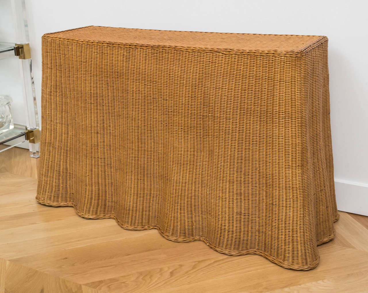 Chic wicker console with a beautiful draped effect.