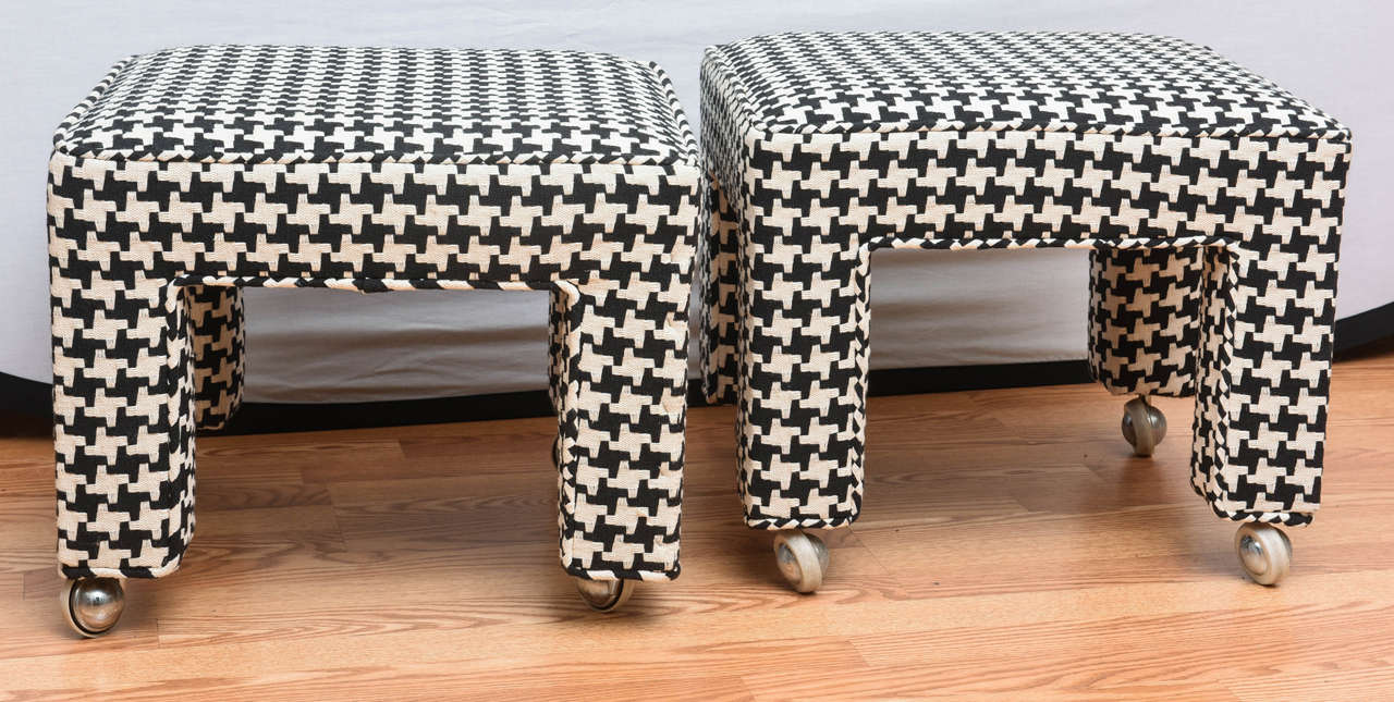 Striking pair of houndstooth upholstered Mid-Century square stools on casters.