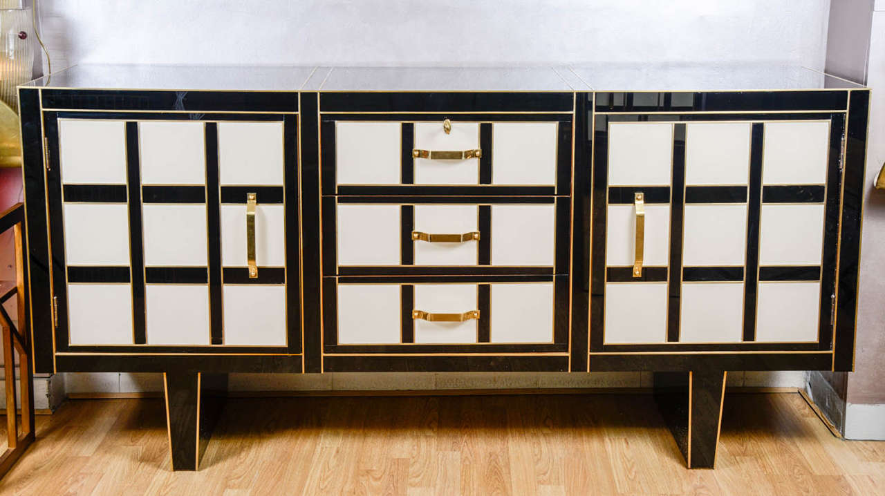 Stately buffet all in black and beige glass tinged in the mass. Two doors, three drawers.