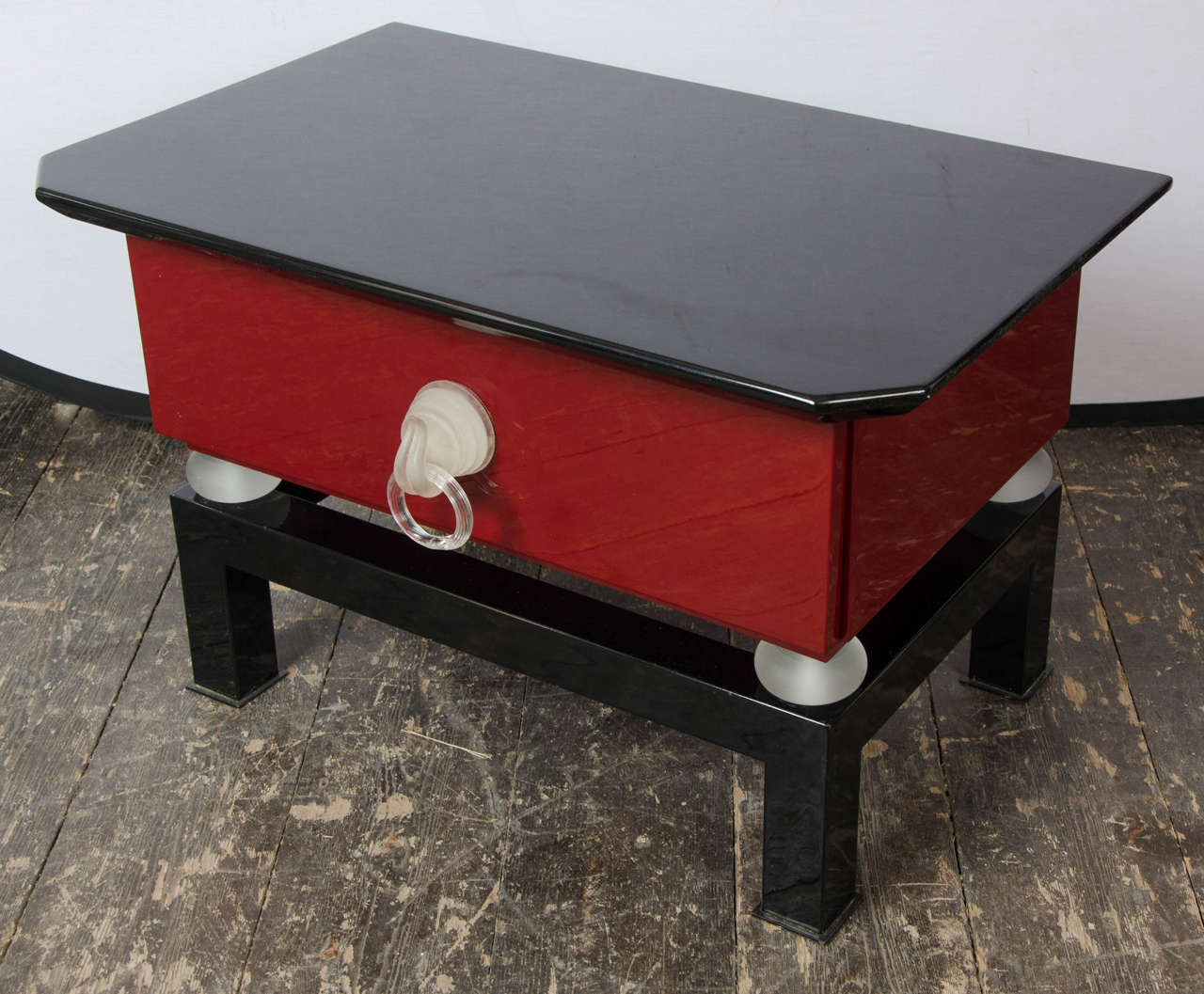 A pair Italian 70's black and red lacquer side tables