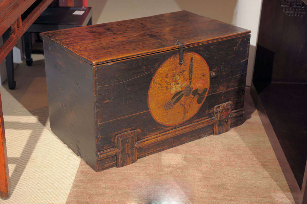 Large hand painted storage trunk with original hardware from the Shanxi province in China.  Signed painting depicts a bird sitting on a lotus. Pine wood.