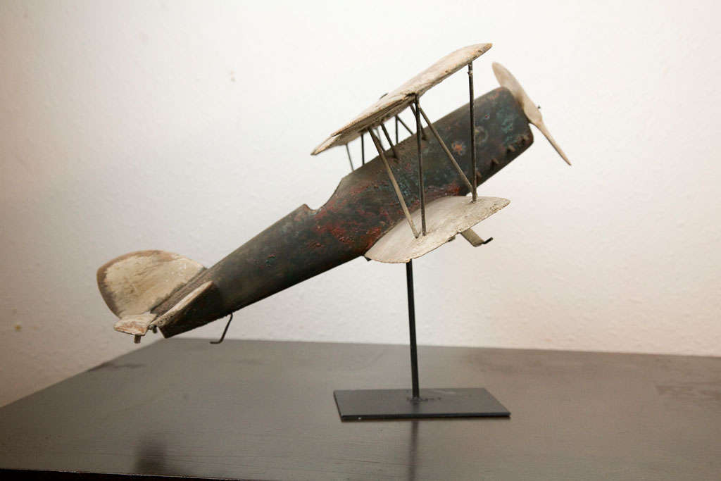 Folk art airplane with rotating propeller and movable wing rudders.  Made with great detail.  Superb original paint surface with perfectly alligatored paint. Please see images for close-up of paint detail.